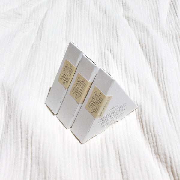 Three packaged triangle soaps lined up
