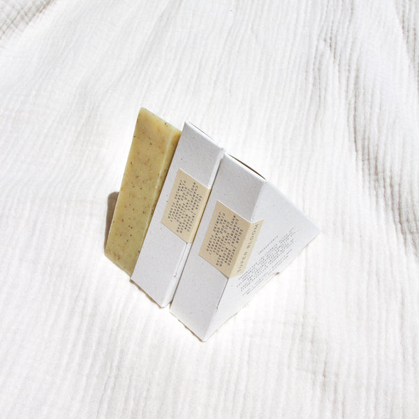 Three triangle soaps against textured linen
