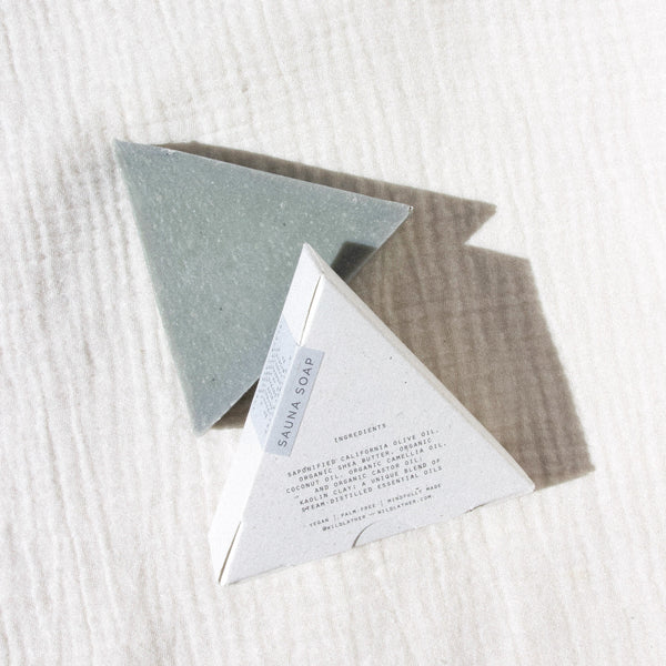 Two triangle soaps against textured linen